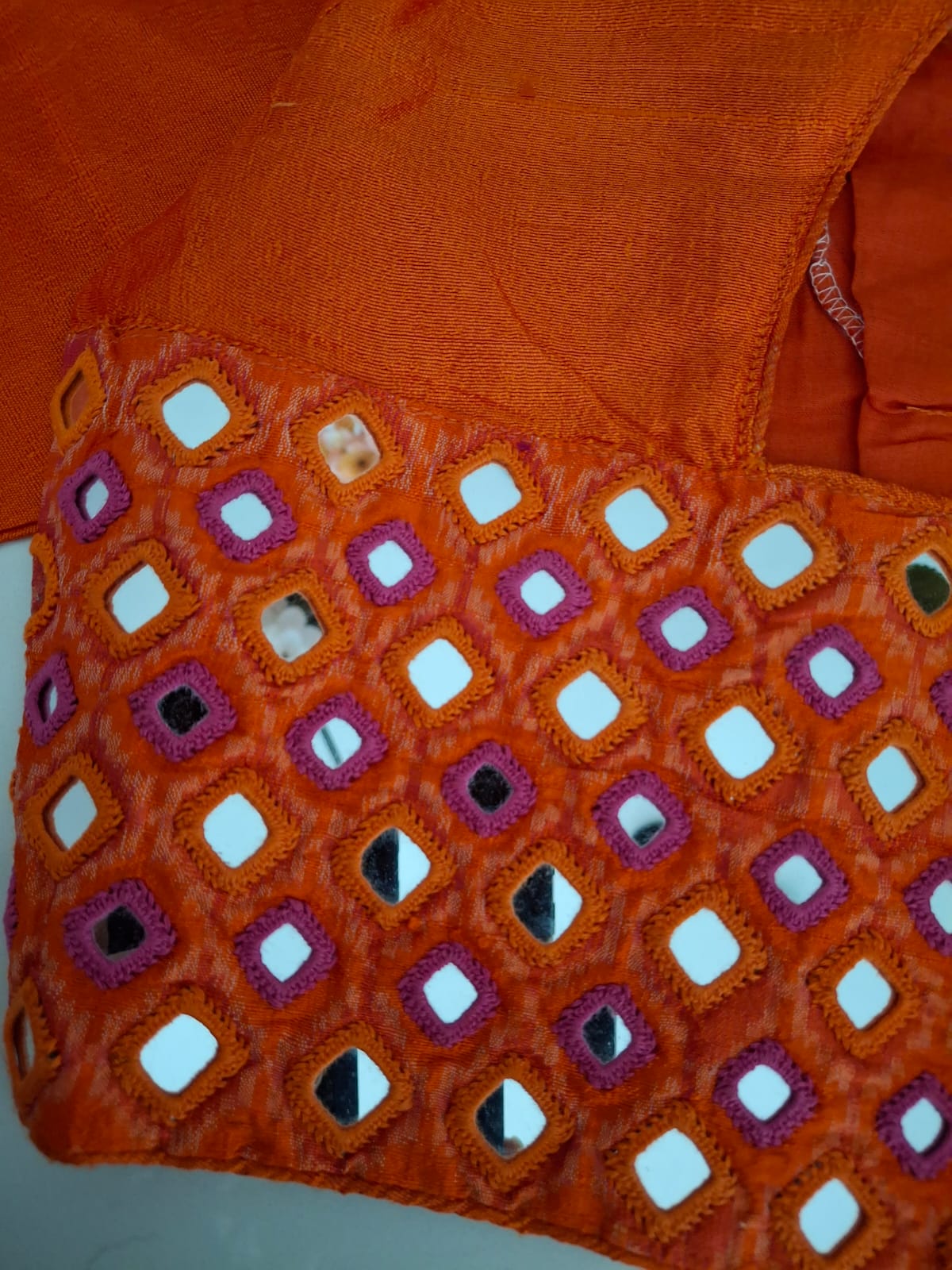 hand embroidered Mirror Work ikkat blouse - Saffron